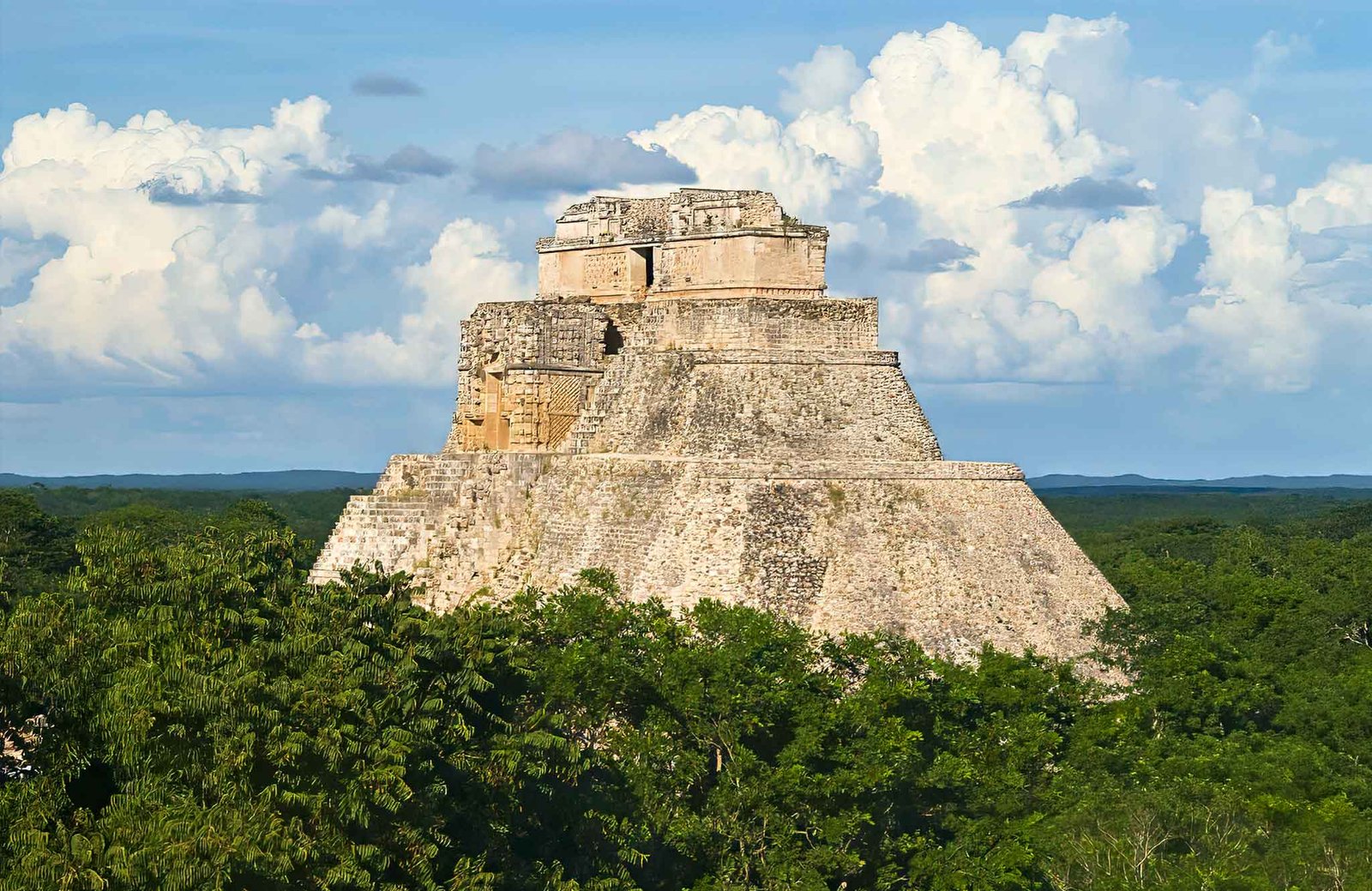 Adivino Pyramid rising from the lush rainforest in the UNESCO World Heritage Site of Campeche, Mexico