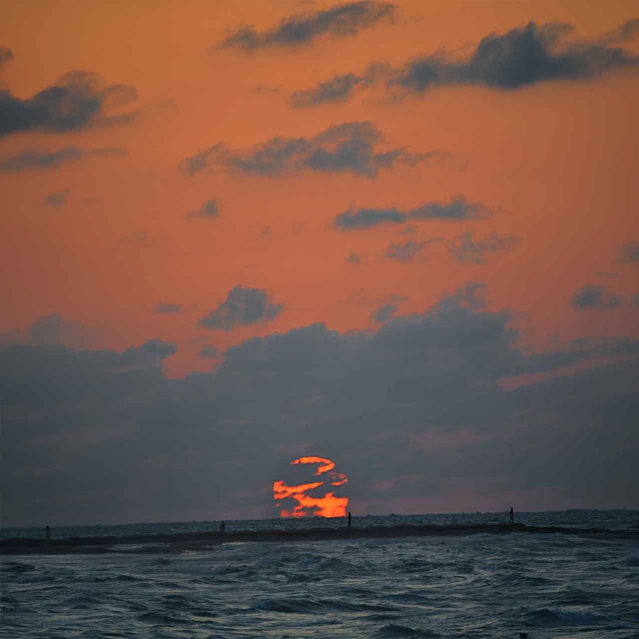 Sunset over the Caribbean Sea in Cozumel for private Quintana Roo journeys by coast and island