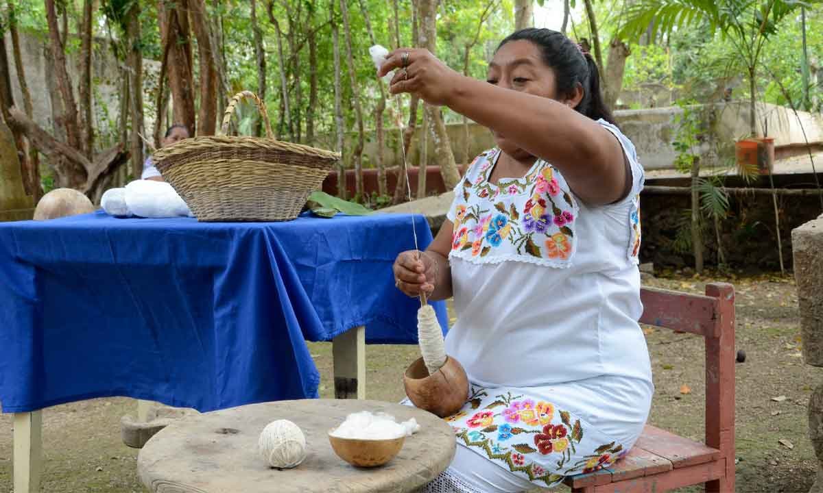 Traveler learning a traditional craft technique with local guidance during a respectful private Mexico journey.